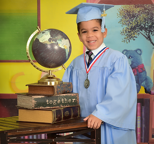 Child posing for school graduation