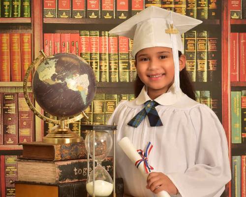  Young girl in graduation gown